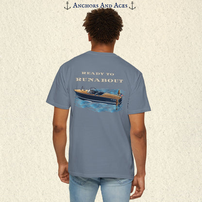 Model wearing a Blue Jean classic wooden boat T-shirt from the back, featuring a vintage runabout on reflective blue water with Ready to Runabout text.