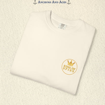 Folded Ivory Slot King T-shirt showing the small gold King of Spins chest emblem.