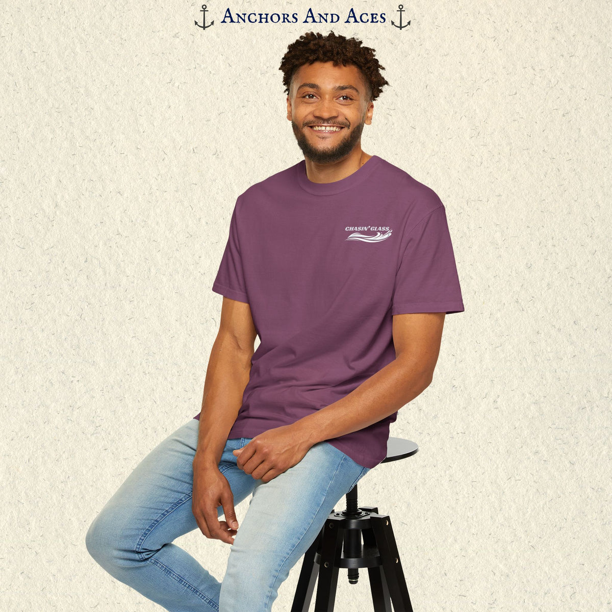 Model wearing a Berry purple vintage water ski T-shirt, front view, with the small white Chasin' Glass text and stylized water splash logo on the left chest.