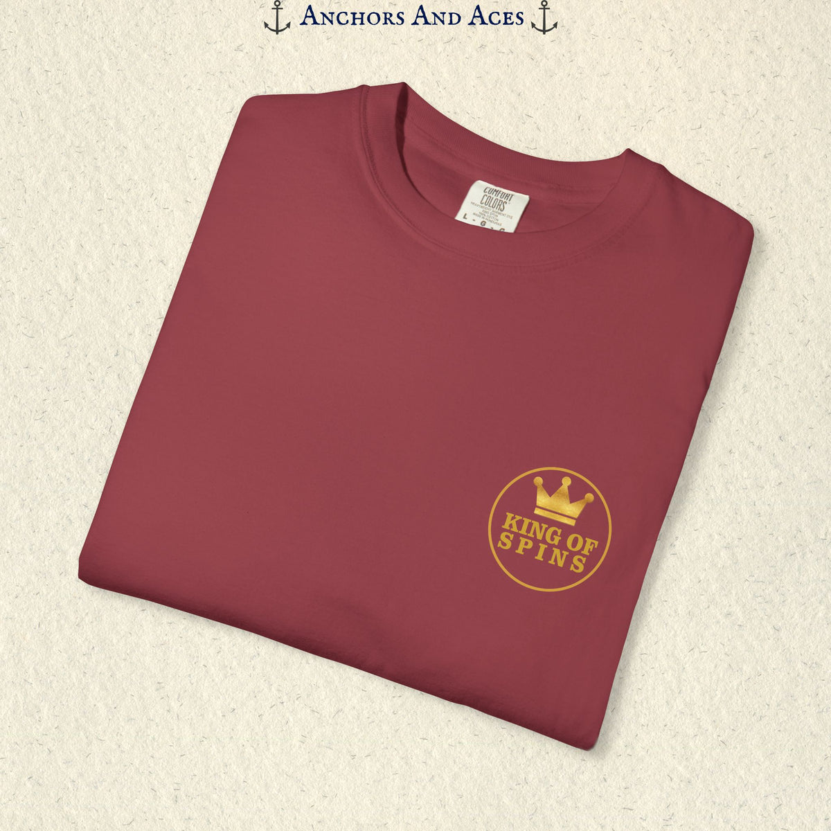 Folded Chili Slot King T-shirt showing the small gold King of Spins chest emblem.