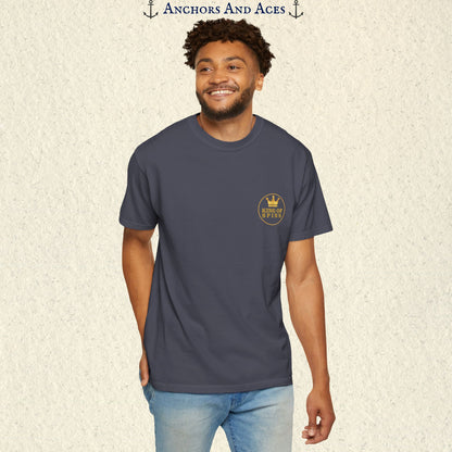Man wearing a Navy Slot King T-shirt with the small gold King of Spins emblem on the front.
