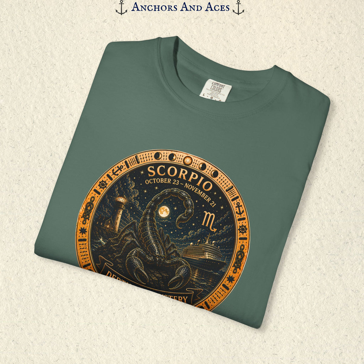 Folded Scorpio zodiac shirt close-up showing scorpion celestial medallion and Depths of Mystery artwork