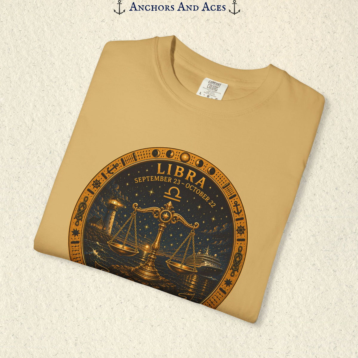 Folded Libra Zodiac Shirt close-up showing the balance scales celestial medallion front graphic.