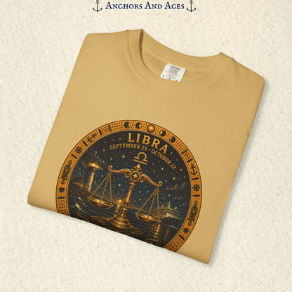 Folded Libra Zodiac Shirt close-up showing the balance scales celestial medallion front graphic.