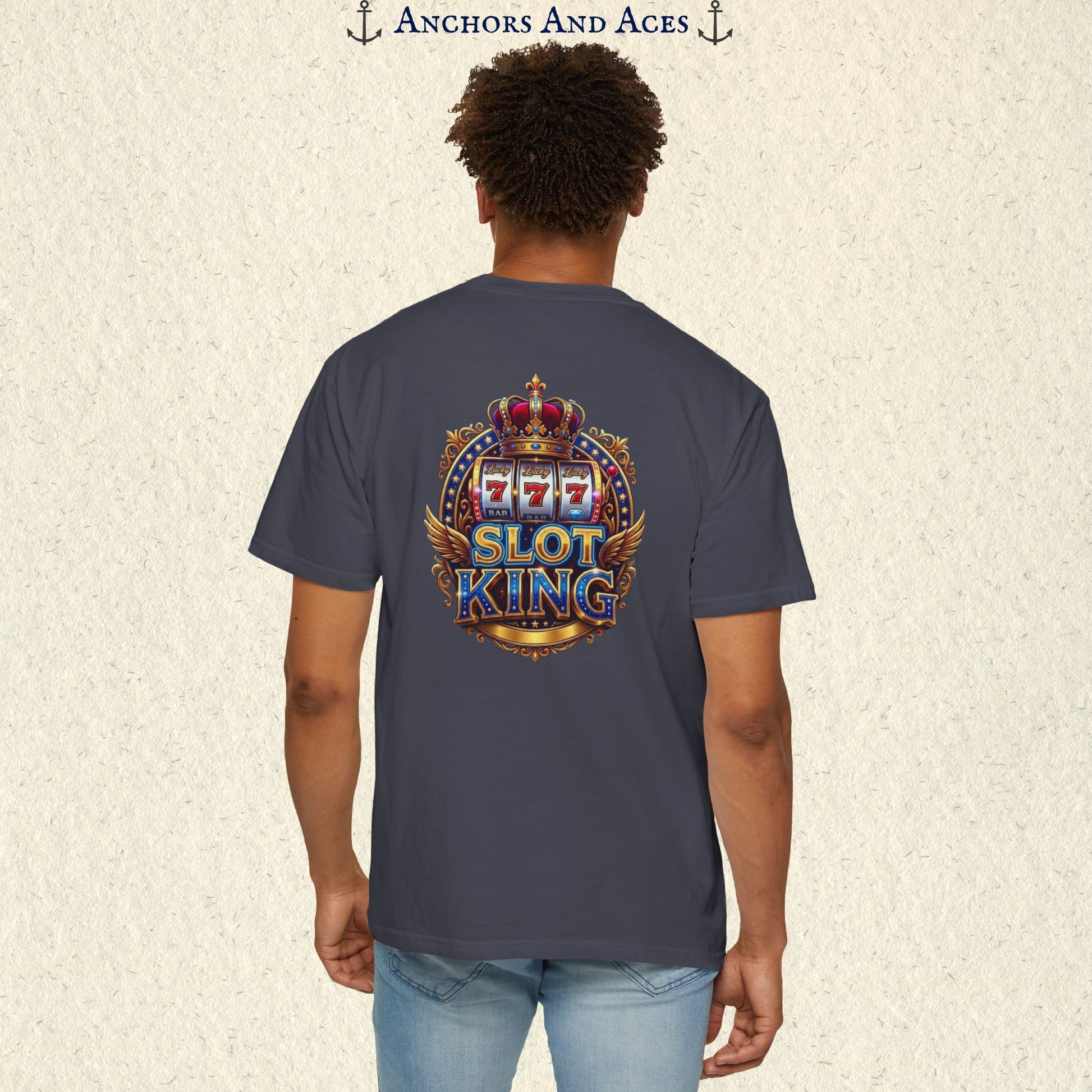 Man wearing a Navy Slot King T-shirt with the crowned 777 slot machine artwork on the back.