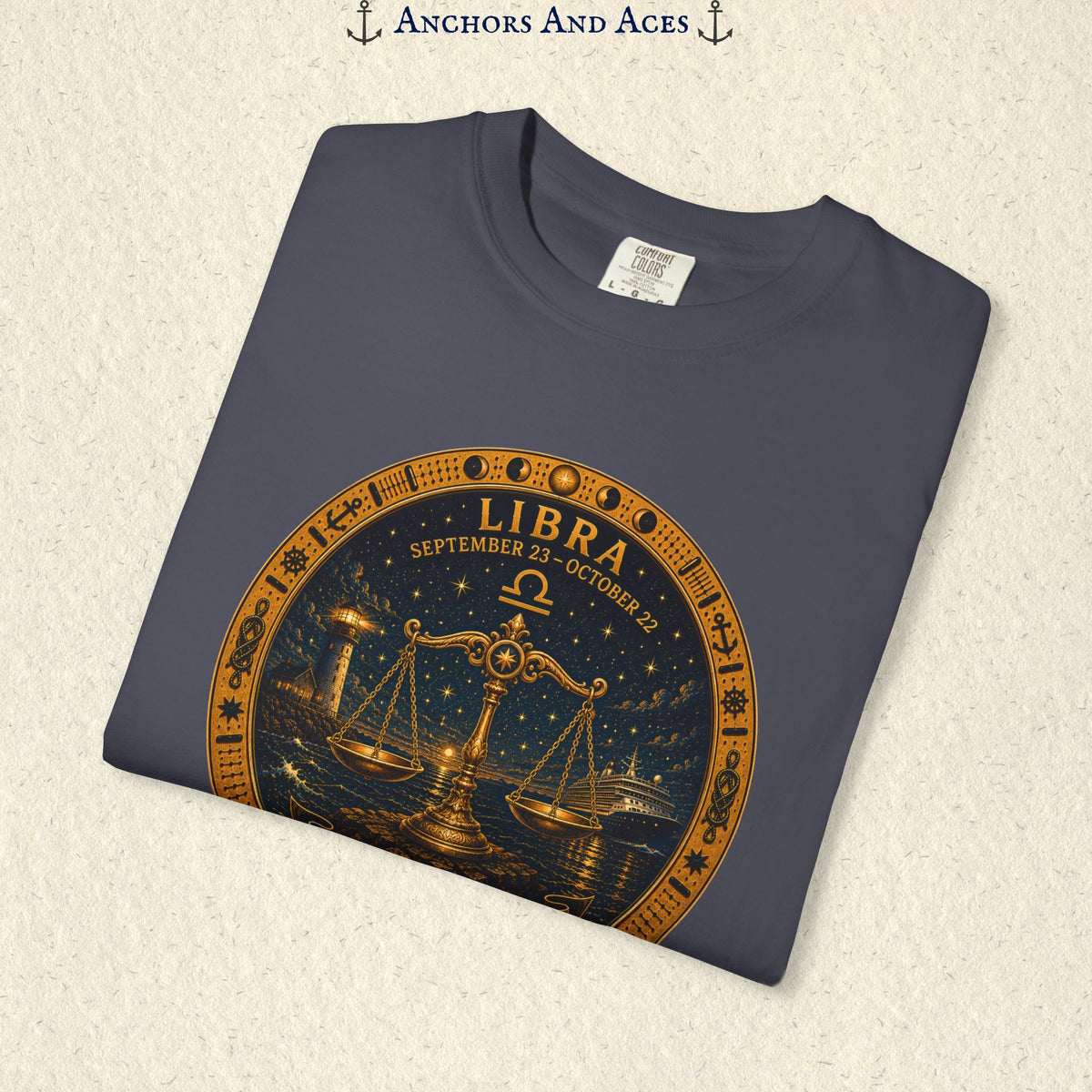 Folded Libra Zodiac Shirt close-up showing the balance scales celestial medallion front graphic.