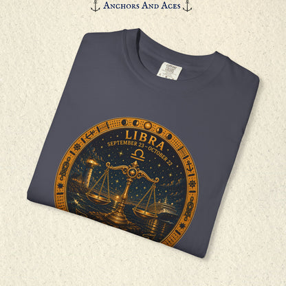 Folded Libra Zodiac Shirt close-up showing the balance scales celestial medallion front graphic.