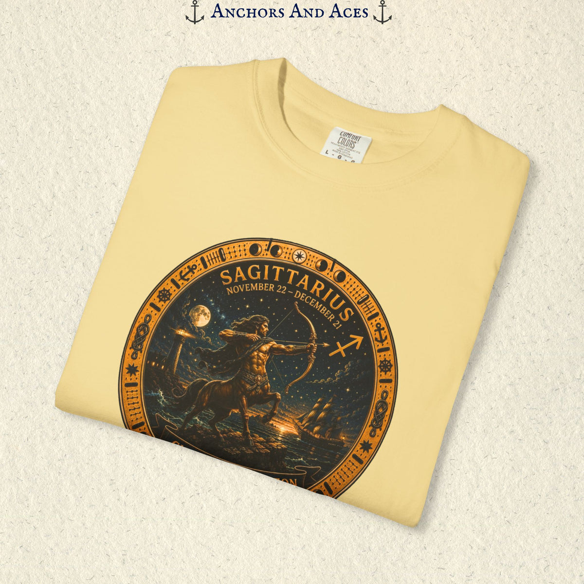 Folded Sagittarius Zodiac Shirt close-up showing the Sagittarius celestial medallion and Chase the Horizon artwork.