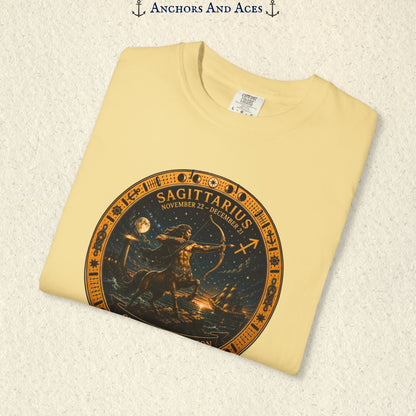 Folded Sagittarius Zodiac Shirt close-up showing the Sagittarius celestial medallion and Chase the Horizon artwork.