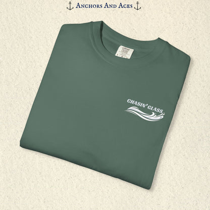 Folded Blue Spruce T-shirt showing the small white Chasin' Glass water splash logo on the left chest.