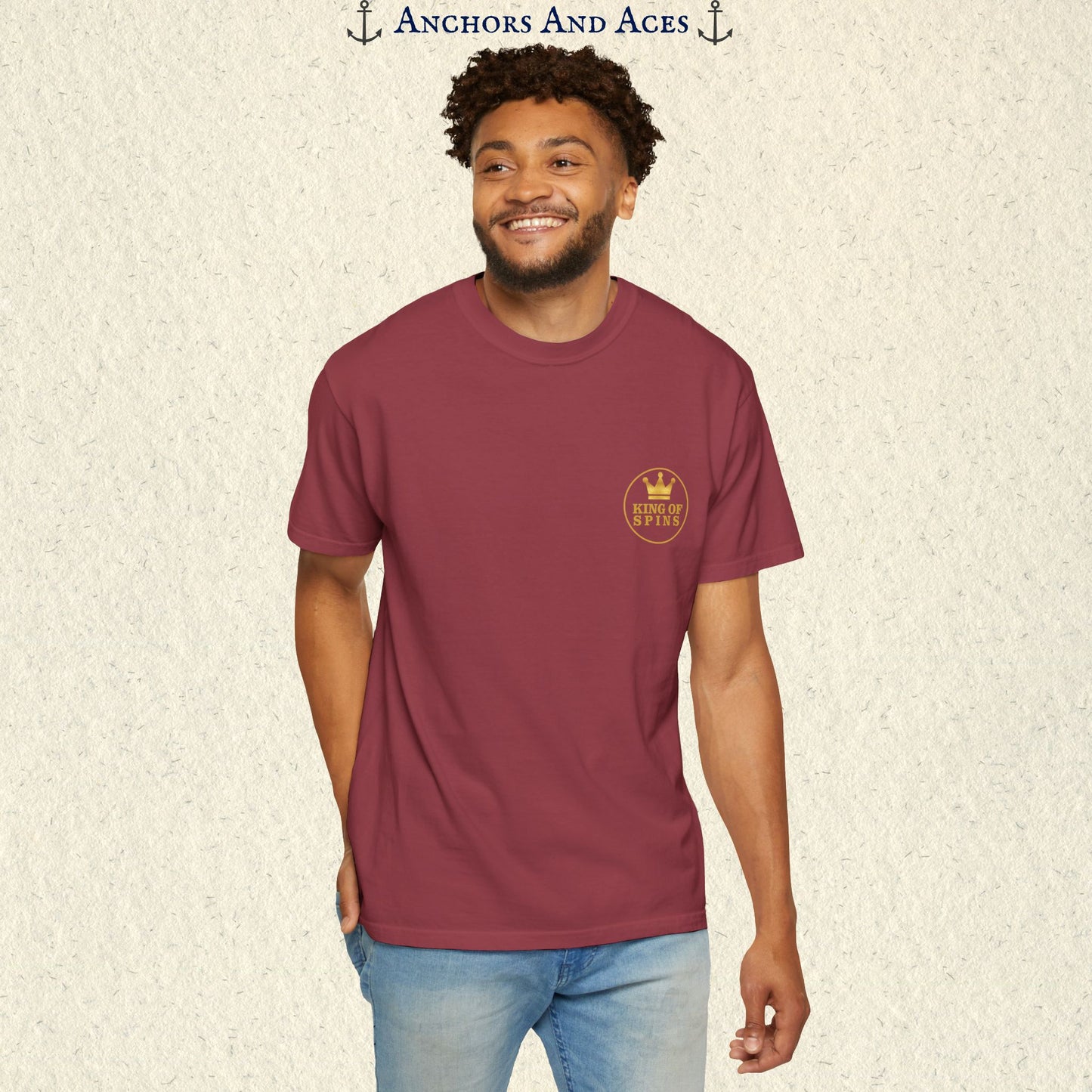 Man wearing a Chili Slot King T-shirt with the small gold King of Spins emblem on the front.