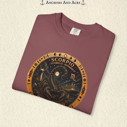 Folded Scorpio zodiac shirt close-up showing scorpion celestial medallion and Depths of Mystery artwork