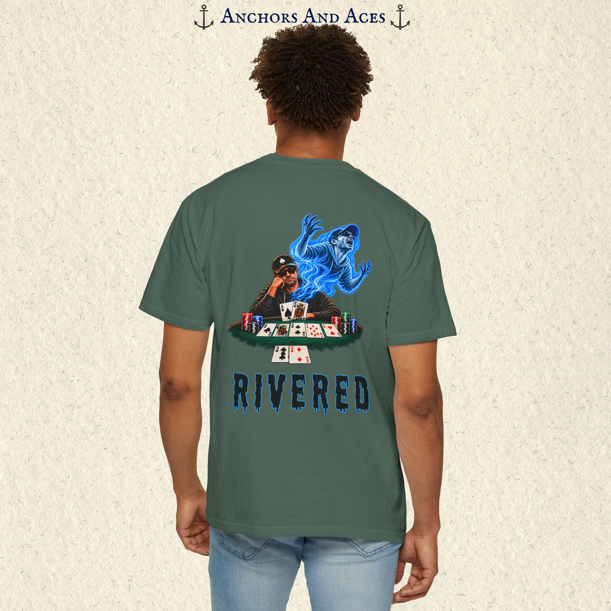 Model wearing RIVERED Texas Hold'em poker graphic tee back view featuring a player at a poker table with playing cards, poker chips, and an electric blue soul rising from his body after a bad beat on the river.  Comfort Colors 1717