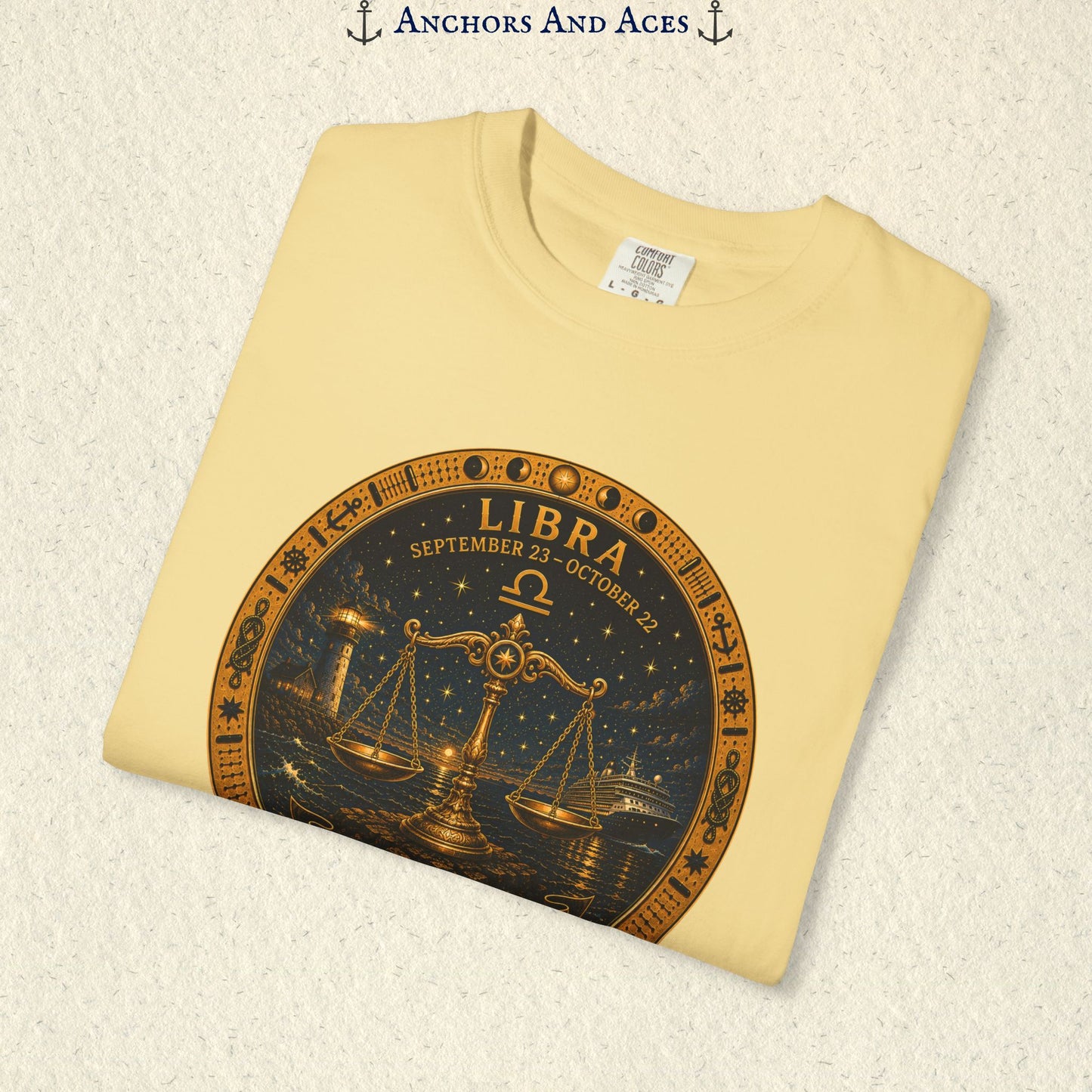 Folded Libra Zodiac Shirt close-up showing the balance scales celestial medallion front graphic.