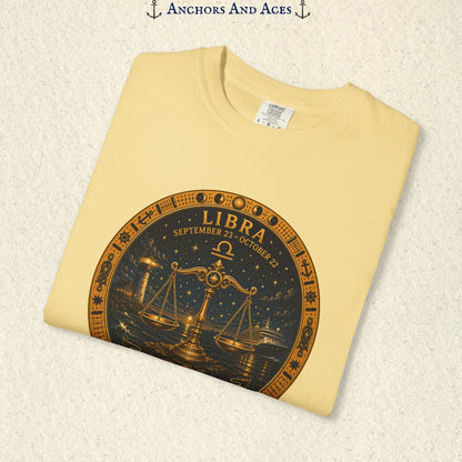 Folded Libra Zodiac Shirt close-up showing the balance scales celestial medallion front graphic.