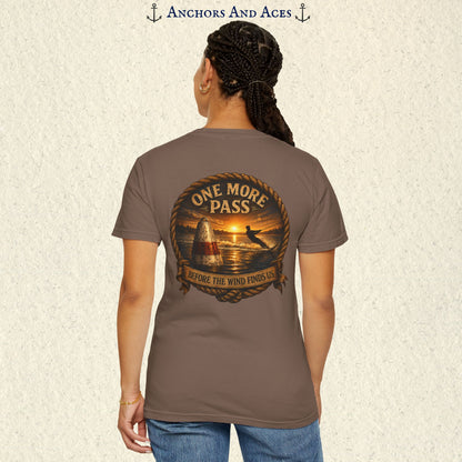 Model wearing a Espresso brown vintage slalom water ski T-shirt, back view, with sunrise lake artwork featuring a slalom buoy, water skier, rope border, and One More Pass text.