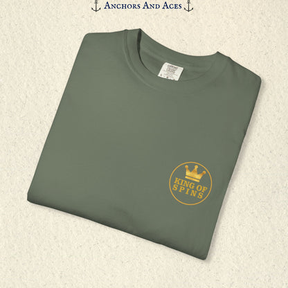 Folded Moss Slot King T-shirt showing the small gold King of Spins chest emblem.
