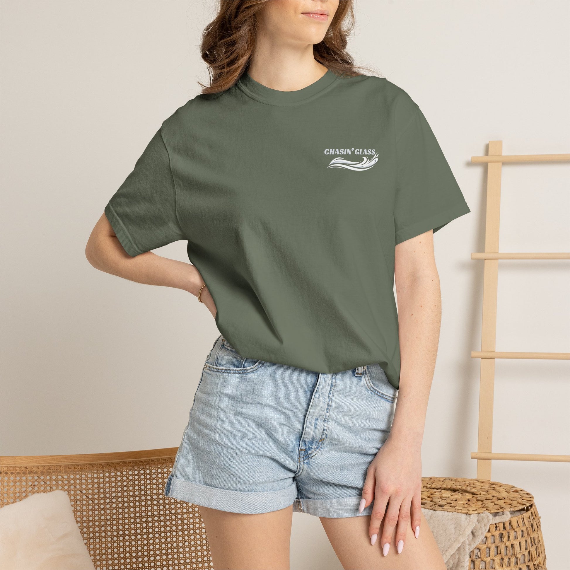 Model wearing a Moss Comfort Colors 1717 water ski t-shirt from the front, showing the small white Chasin' Glass water-splash logo on the left chest.