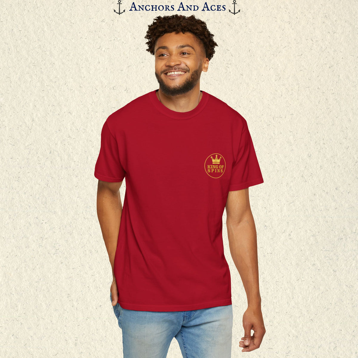 Man wearing a Red Slot King T-shirt with the small gold King of Spins emblem on the front.