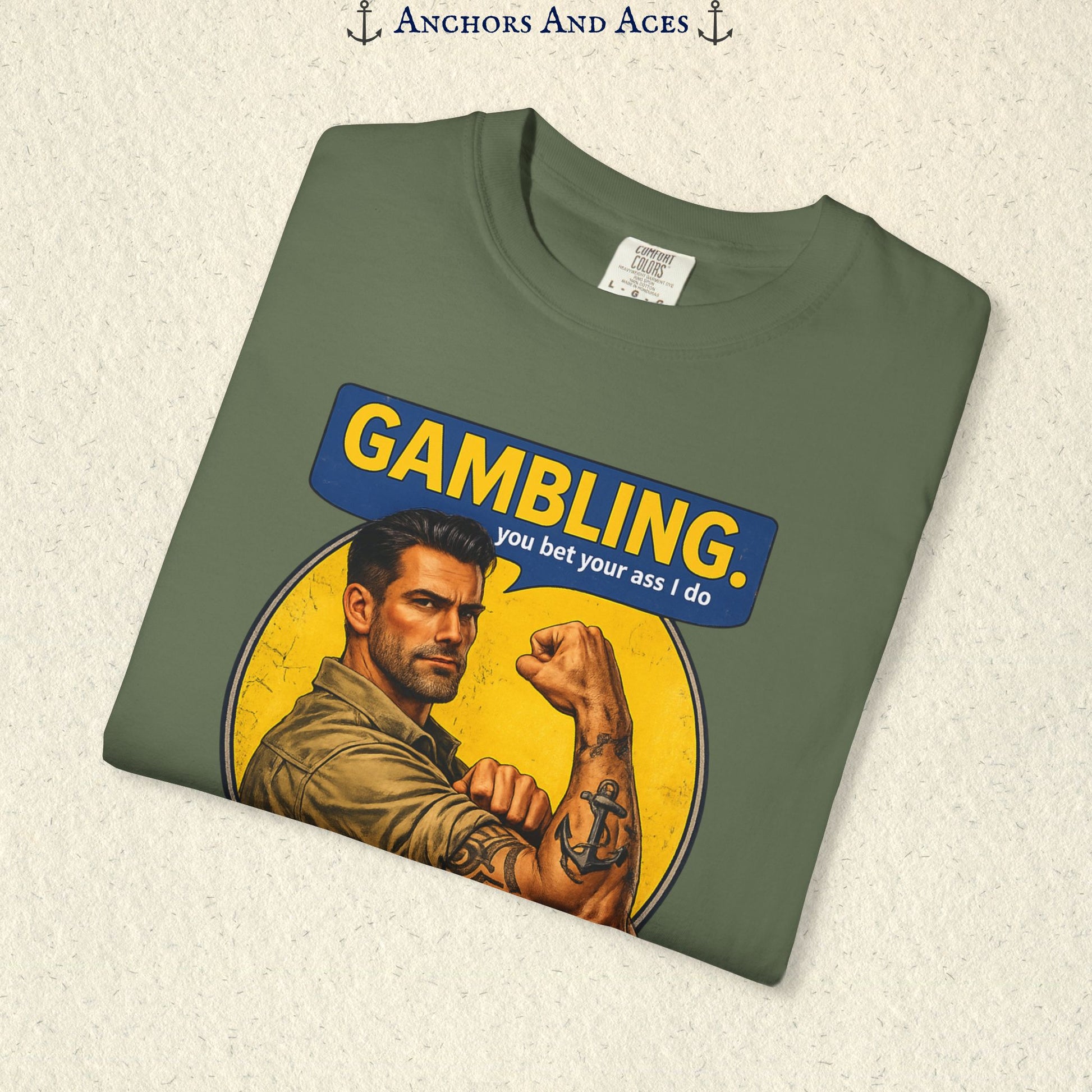 Folded Sage funny gambling T-shirt showing the retro strongman flexing beneath bold GAMBLING text.