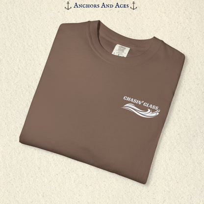 Folded Espresso brown T-shirt showing the small white Chasin' Glass text and stylized water splash logo on the left chest.