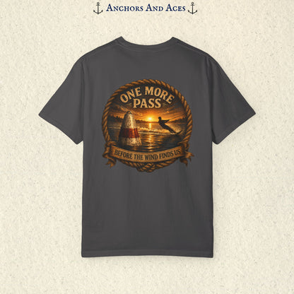 Graphite gray vintage slalom water ski T-shirt shown from the back with a sunrise lake graphic featuring a slalom buoy, water skier, rope border, and the text One More Pass and Before the Wind Finds Us.