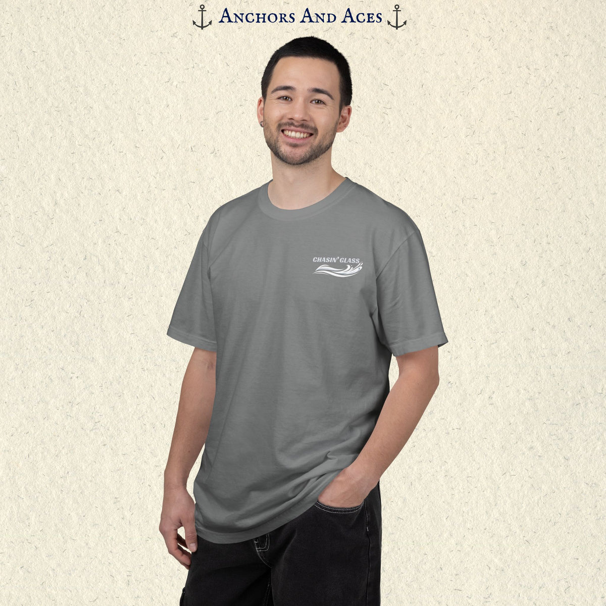 Model wearing a Grey Comfort Colors 1717 water ski t-shirt from the front, showing the small white Chasin' Glass water-splash logo on the left chest.