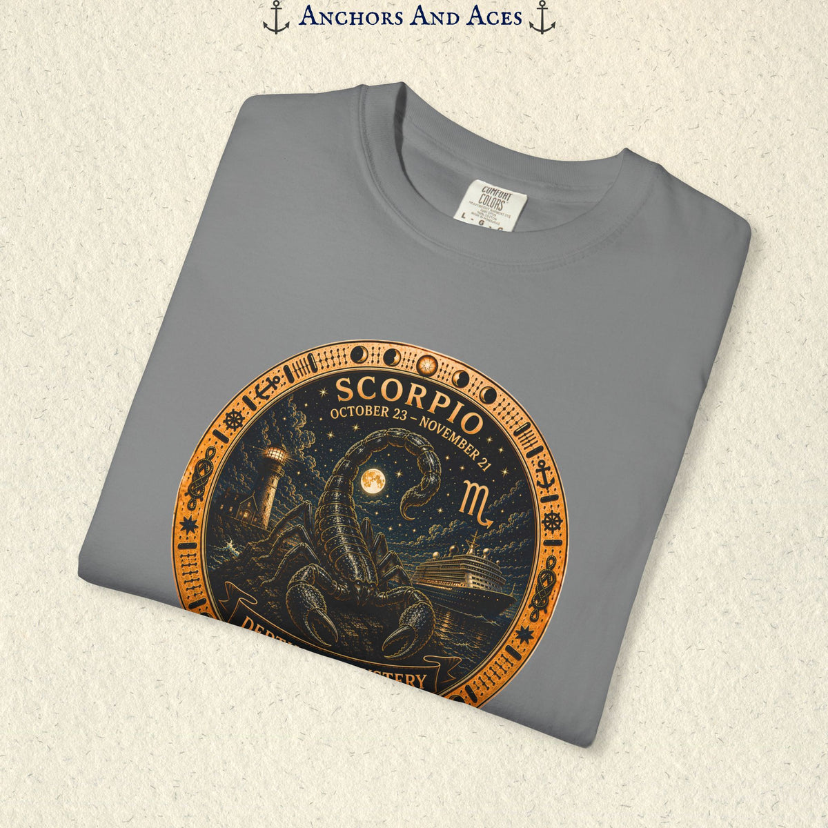 Folded Scorpio zodiac shirt close-up showing scorpion celestial medallion and Depths of Mystery artwork
