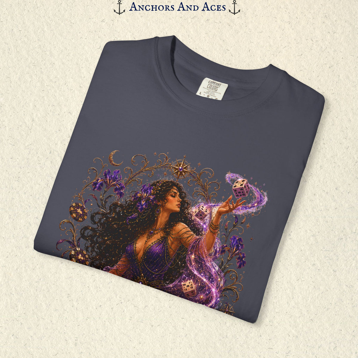 Close-up of Goddess of Chance Art Nouveau graphic on Navy Comfort Colors tee with illustrated goddess, dice, irises, and gold filigree.