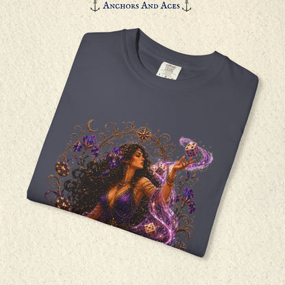 Close-up of Goddess of Chance Art Nouveau graphic on Navy Comfort Colors tee with illustrated goddess, dice, irises, and gold filigree.