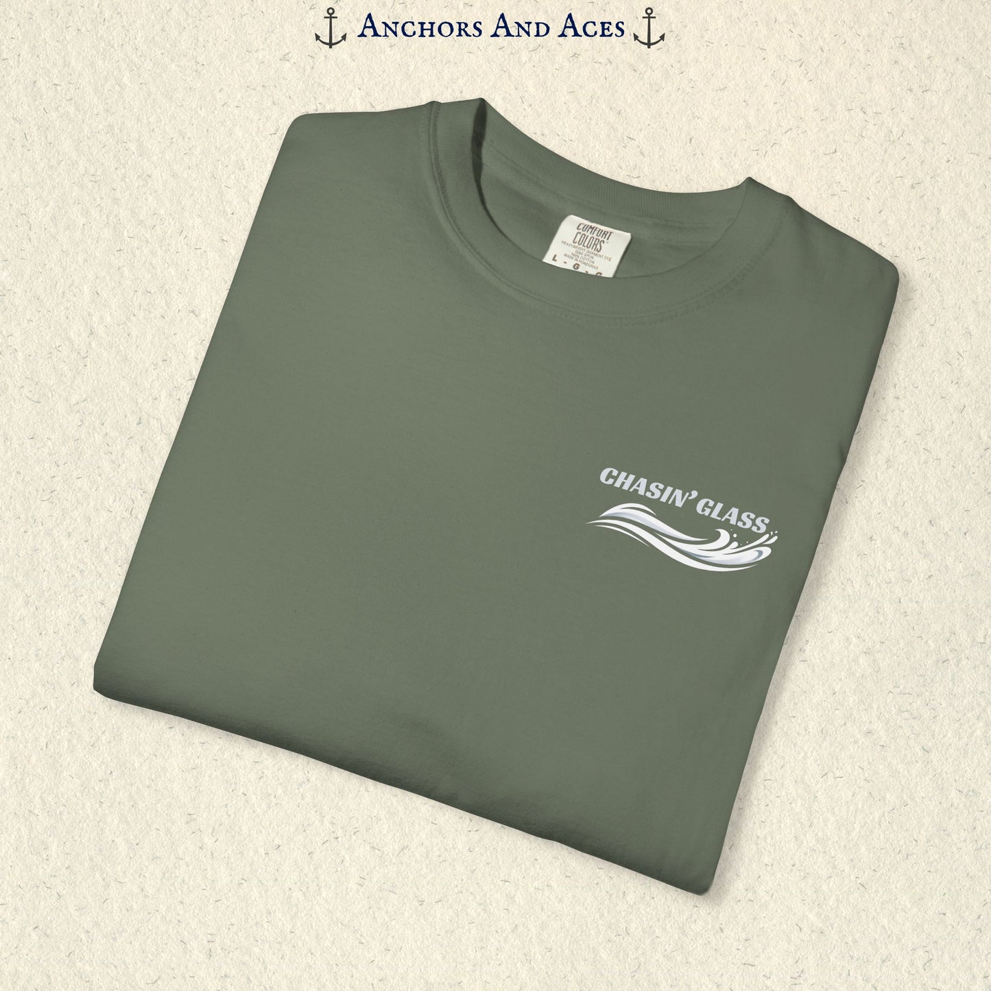 Folded Moss green T-shirt showing the small white Chasin' Glass text and stylized water splash logo on the left chest.