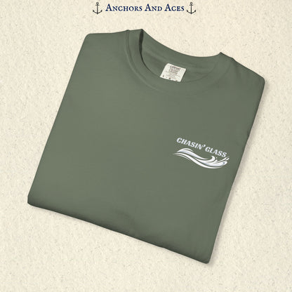 Folded Moss green T-shirt showing the small white Chasin' Glass text and stylized water splash logo on the left chest.