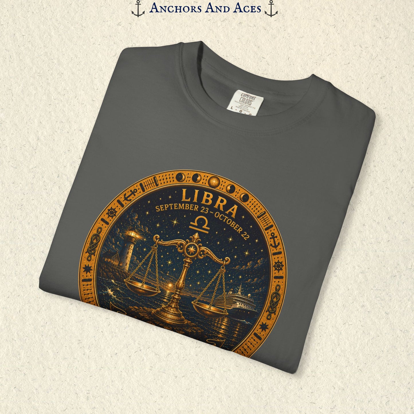 Folded Libra Zodiac Shirt close-up showing the balance scales celestial medallion front graphic.
