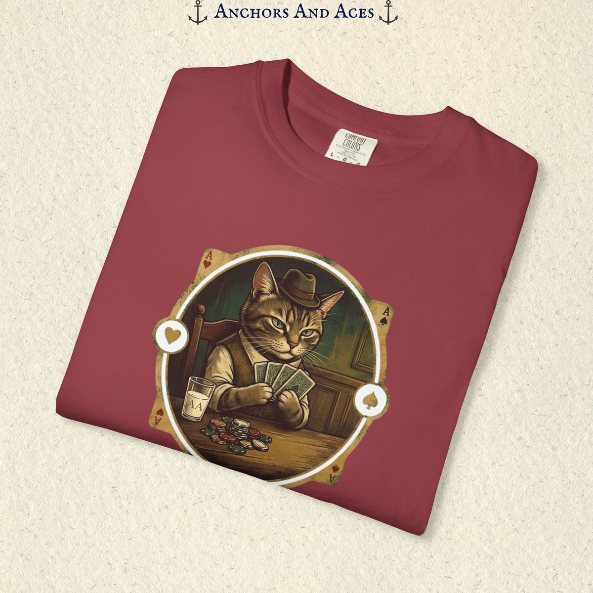 Folded Chili red vintage poker cat shirt showing the card-playing cat and retro casino artwork.