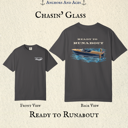Front and back view of a Graphite classic wooden boat T-shirt. The front features the small white Chasin' Glass water splash logo, and the back features a vintage wooden runabout on reflective blue water with Ready to Runabout text.