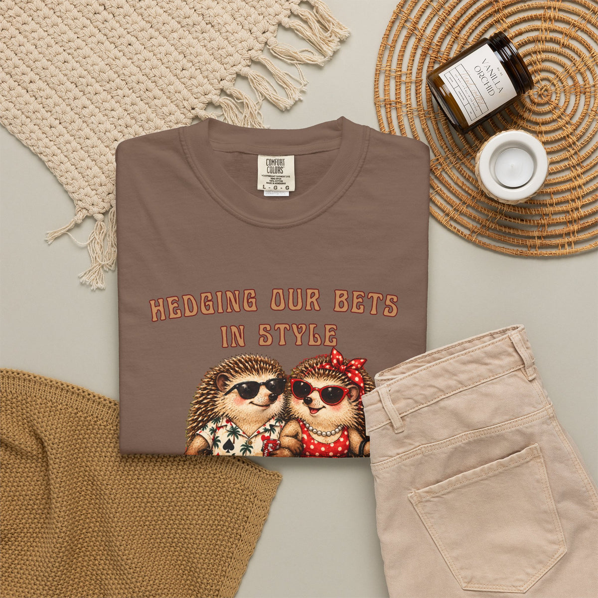 Hedging Our Bets in Style personalized gambling shirt shown folded in a lifestyle flat lay with hedgehog couple artwork.