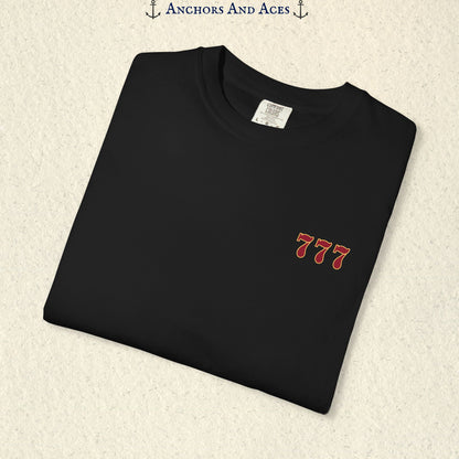Folded Black Lucky 777s T-shirt showing the small red 777 casino emblem on the front chest.
