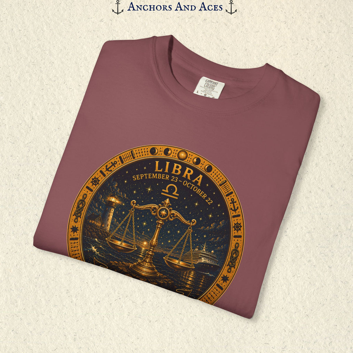 Folded Libra Zodiac Shirt close-up showing the balance scales celestial medallion front graphic.