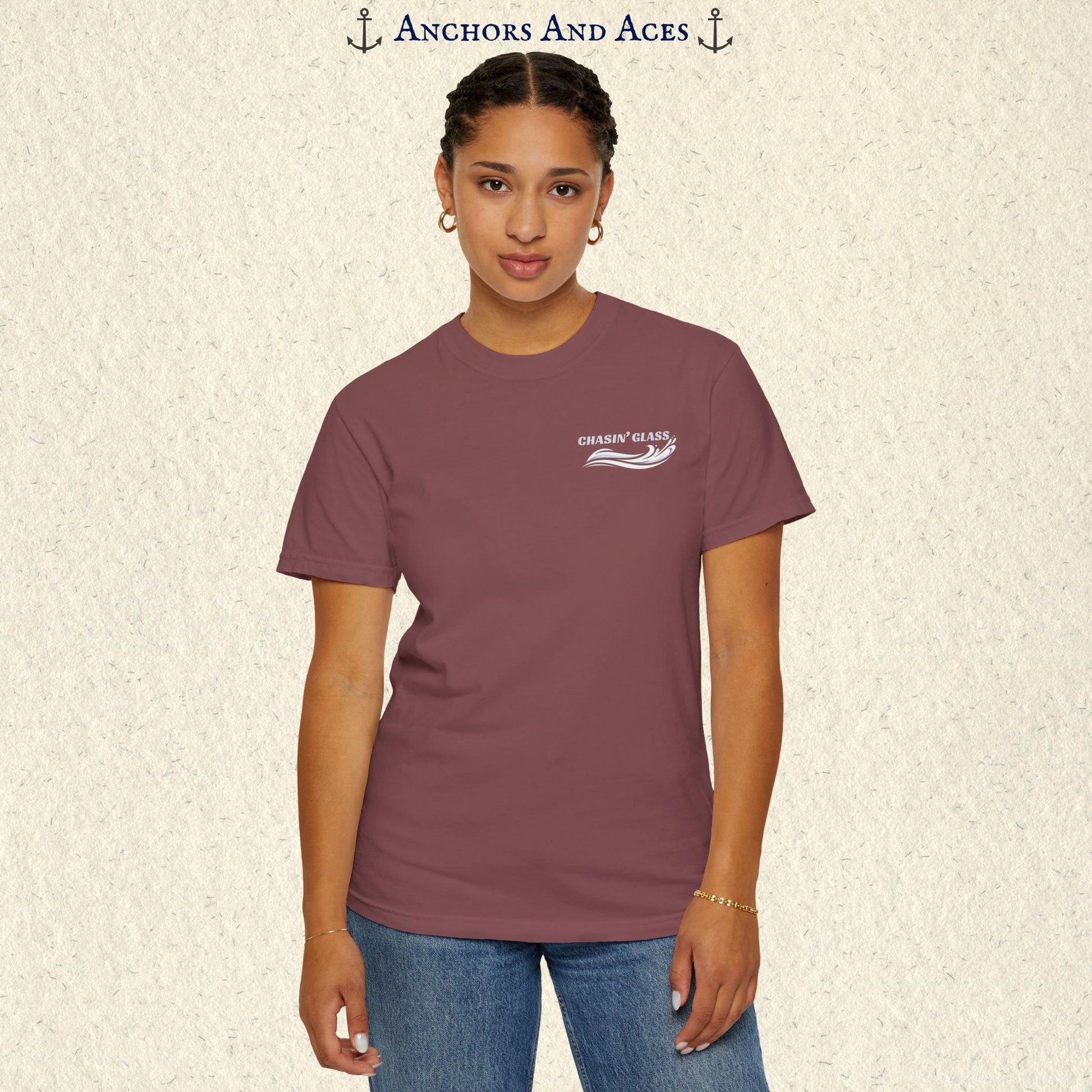 Model wearing a Brick red vintage water ski T-shirt, front view, with the small white Chasin' Glass text and stylized water splash logo on the left chest.