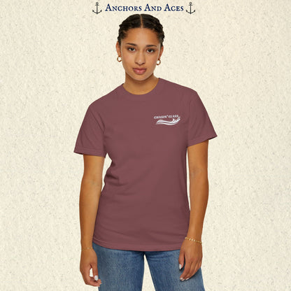 Model wearing a Brick red vintage water ski T-shirt, front view, with the small white Chasin' Glass text and stylized water splash logo on the left chest.