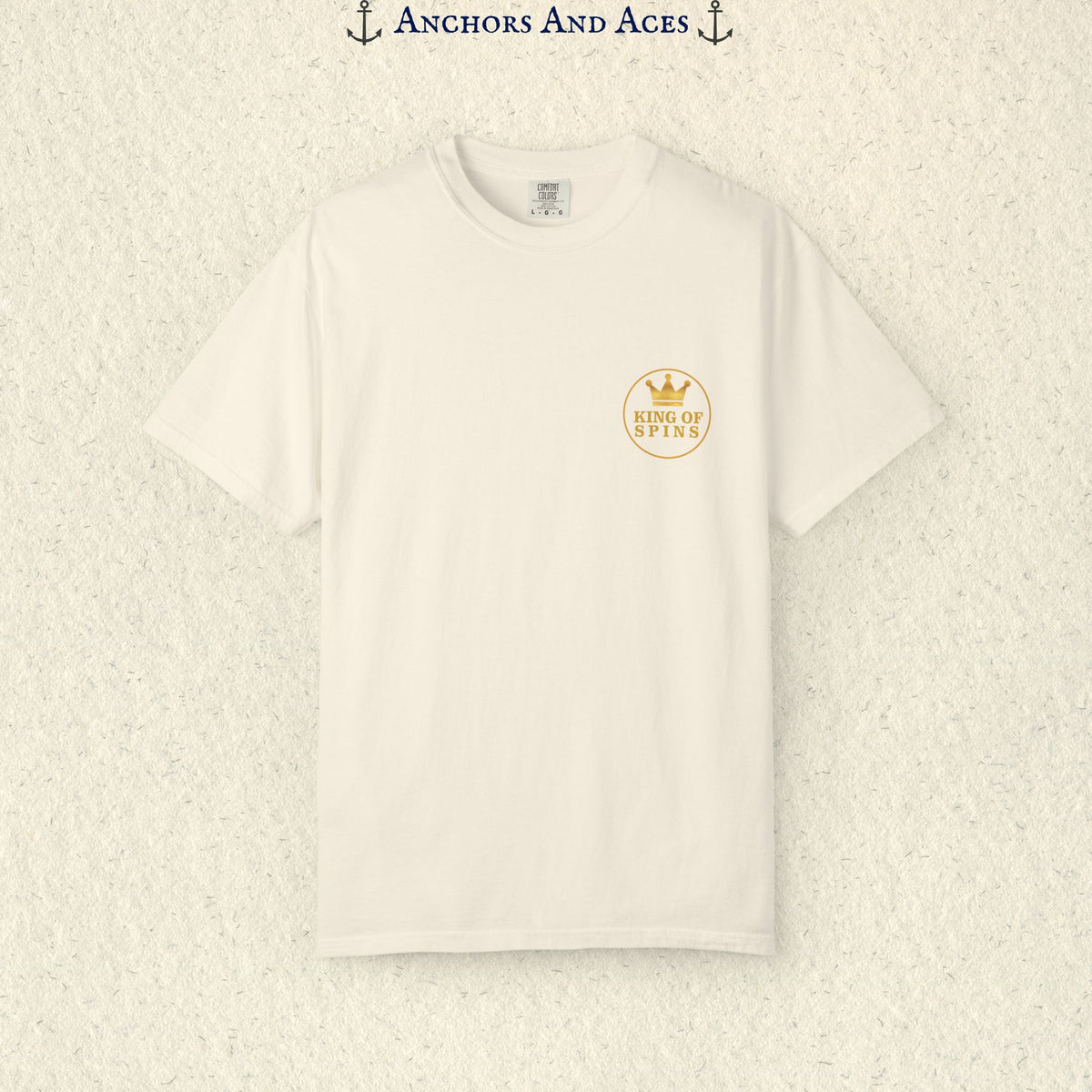 Ivory Slot King T-shirt with a small gold King of Spins emblem on the front chest.