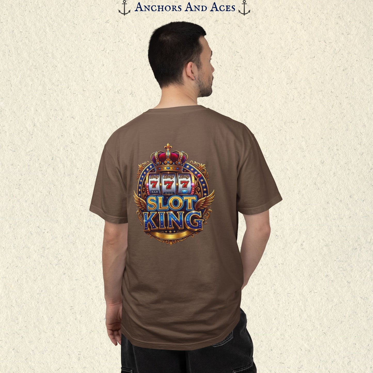 Man wearing an Espresso Slot King T-shirt with the crowned 777 slot machine artwork on the back.