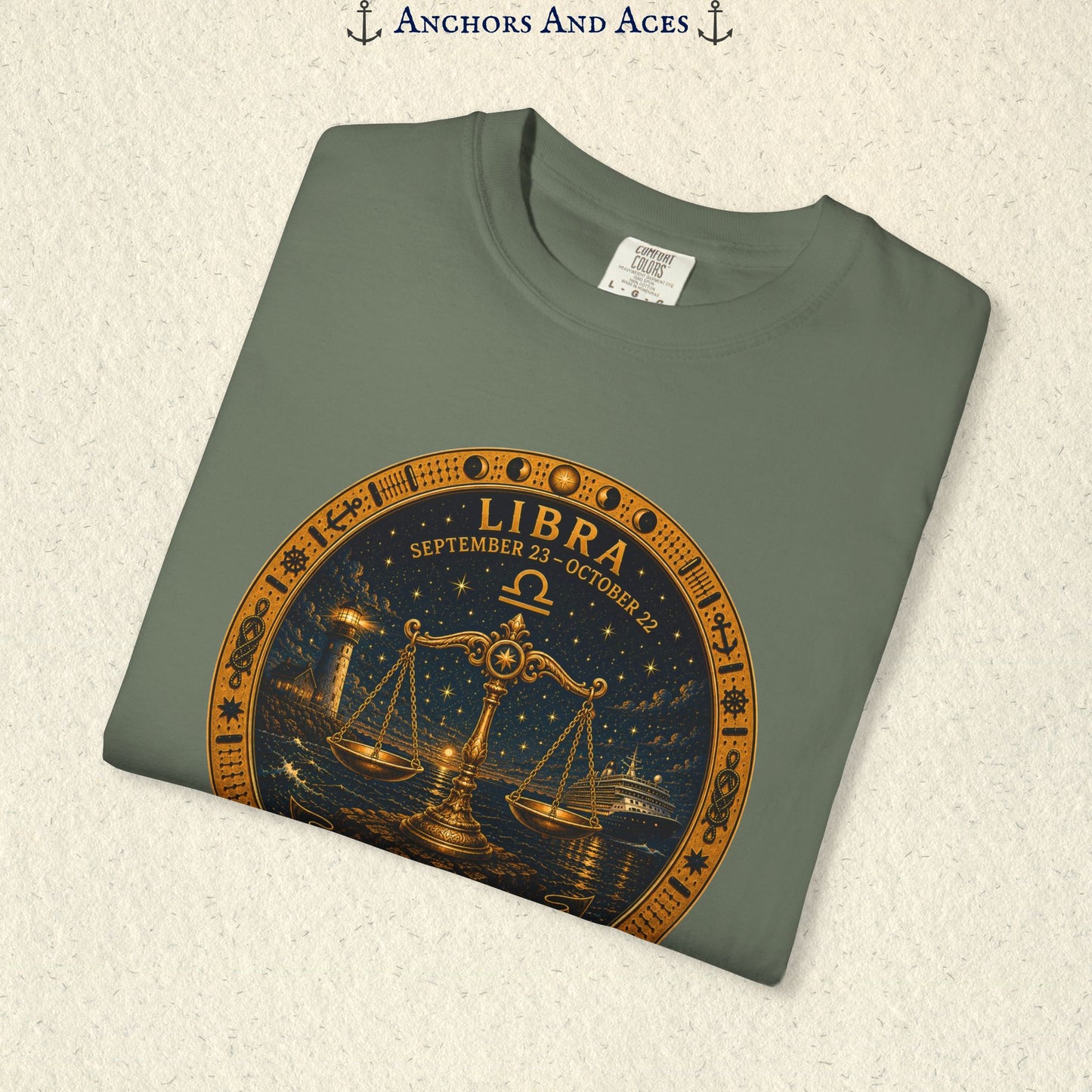 Folded Libra Zodiac Shirt close-up showing the balance scales celestial medallion front graphic.