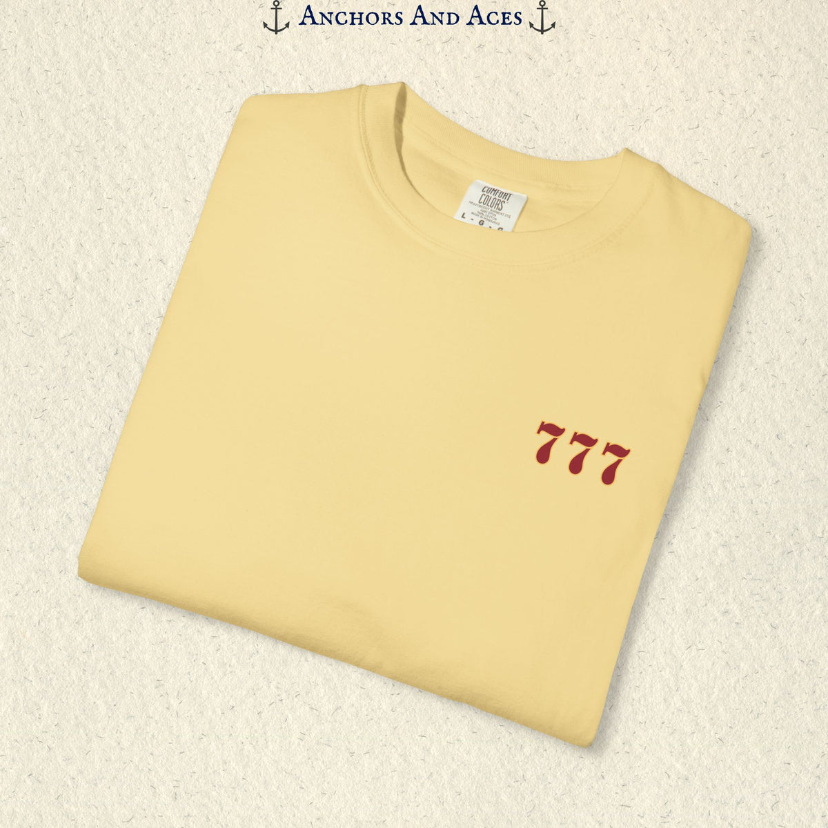 Folded Butter Lucky 777s T-shirt showing the small red 777 casino emblem on the front chest.
