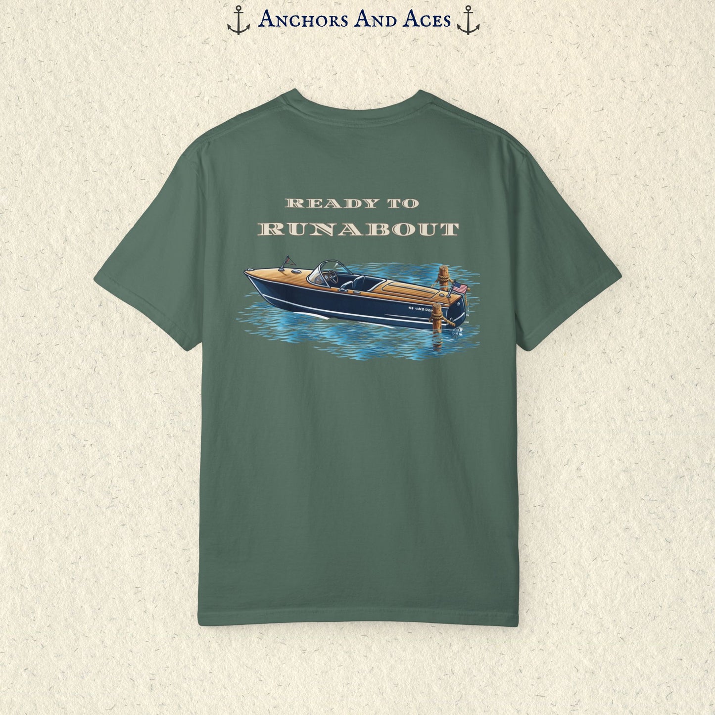 Blue Spruce classic wooden boat T-shirt shown from the back, featuring a vintage runabout on reflective blue water with Ready to Runabout text above the boat.