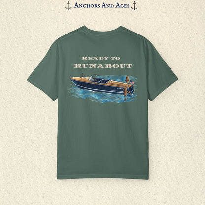 Blue Spruce classic wooden boat T-shirt shown from the back, featuring a vintage runabout on reflective blue water with Ready to Runabout text above the boat.