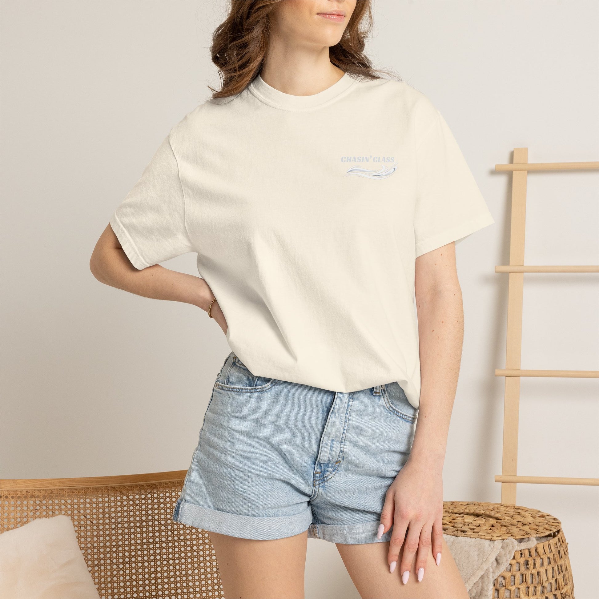 Model wearing a Ivory Comfort Colors 1717 water ski t-shirt from the front, showing the small white Chasin' Glass water-splash logo on the left chest.