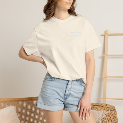 Model wearing a Ivory Comfort Colors 1717 water ski t-shirt from the front, showing the small white Chasin' Glass water-splash logo on the left chest.