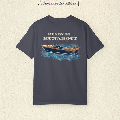 Navy classic wooden boat T-shirt shown from the back, featuring a vintage runabout on reflective blue water with Ready to Runabout text above the boat.
