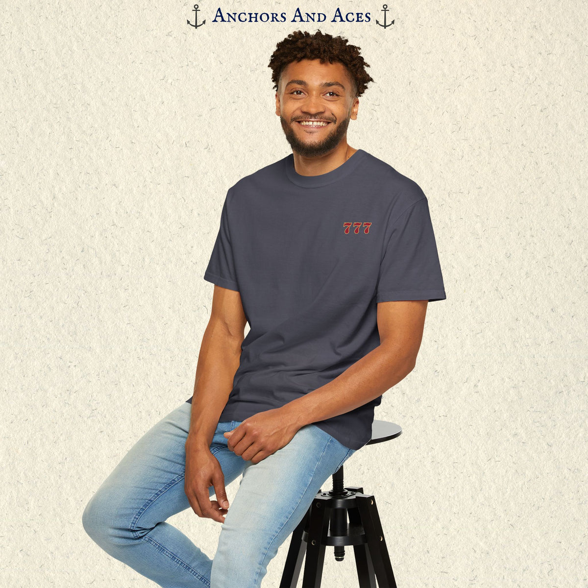 Model wearing a Navy Lucky 777s T-shirt with the small red 777 casino emblem on the front chest.